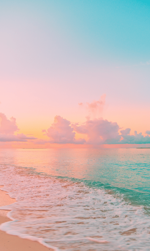 A pastel sunrise over a calm ocean